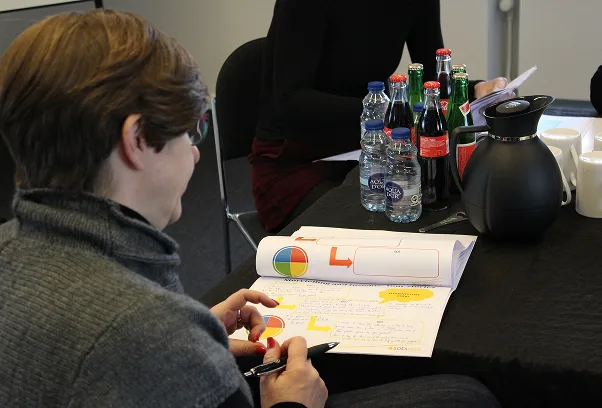 Participant working with a model during a course